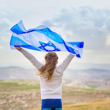 Girl holding Israeli flag